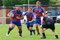 Richard Merrett drives on with James Docherty and Ryan Jones in support.jpg